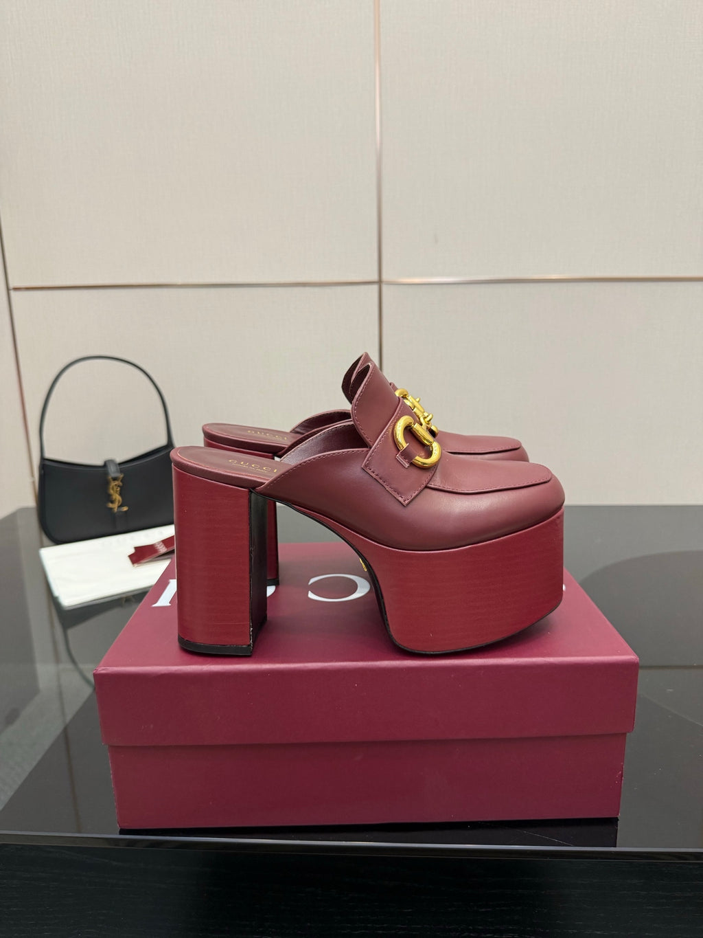 Burgundy Gucci high block heel mules with gold horsebit detail and platform