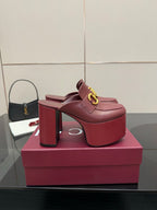 Burgundy Gucci high block heel mules with gold horsebit detail and platform