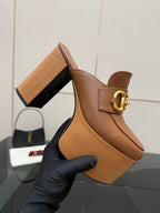 Gucci platform mule close-up, tan leather with gold Horsebit buckle and chunky heel