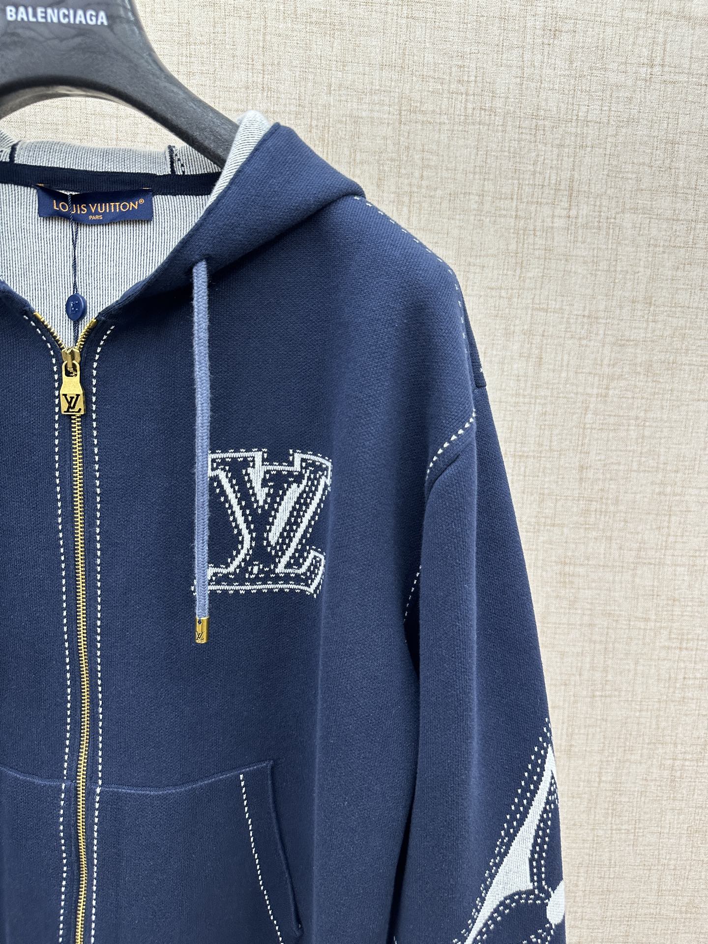 Navy hoodie sleeve and chest logo patch with zip front and hood drawstrings