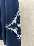 Navy hoodie sleeve with white geometric graphic and dotted pattern