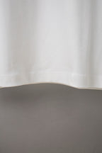 White Balenciaga long-sleeve T-shirt lower back with smooth fabric drape