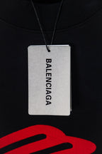 Black long-sleeve T-shirt with Balenciaga paper hang tag