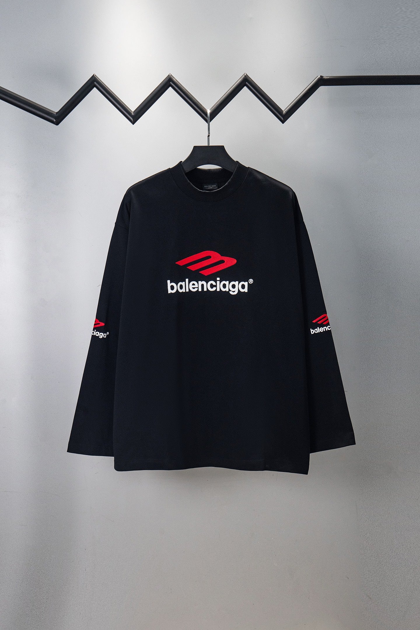 Black long-sleeve T-shirt with red Balenciaga logo on chest