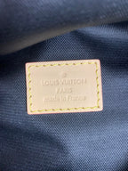 Louis Vuitton PARIS made in France label on dark fabric, stitched leather patch