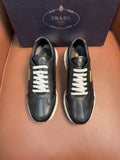 PRADA low-top sneakers, dark leather with white laces and contrasting sole