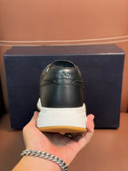 PRADA low-top sneakers heel, dark leather with white midsole and yellow outsole