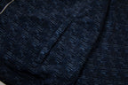 Navy jacket fabric with raised geometric pattern texture