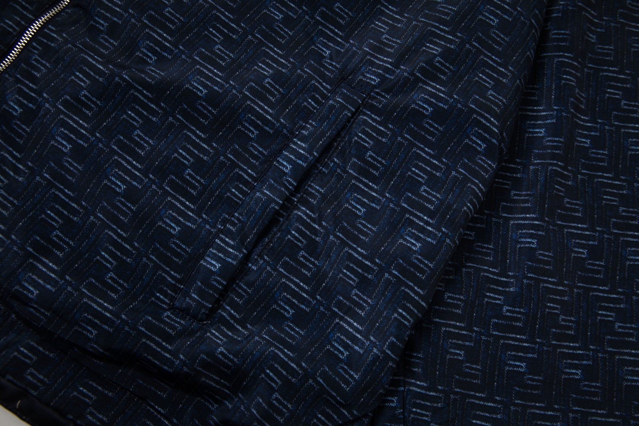 Navy jacket fabric with raised geometric pattern texture