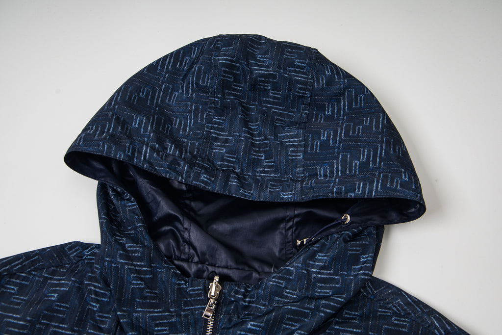 Navy hooded jacket with geometric pattern, inner hood and zipper visible