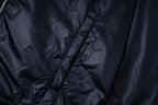 Navy hooded jacket fabric with seam lines and diagonal quilting