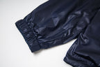 Navy jacket sleeve with elastic cuff and gathered hem
