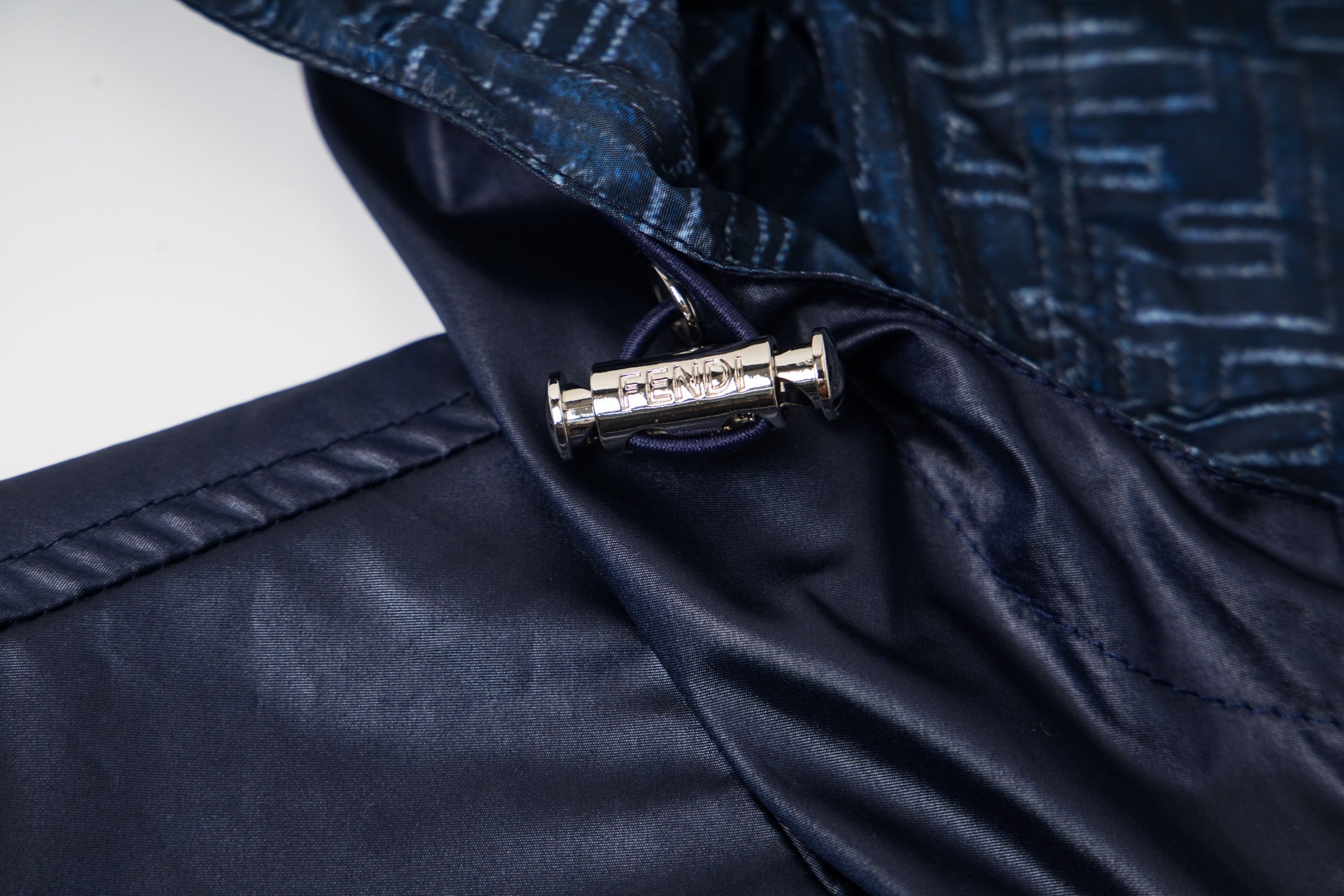 Navy jacket zipper and collar snap with metal pull tab