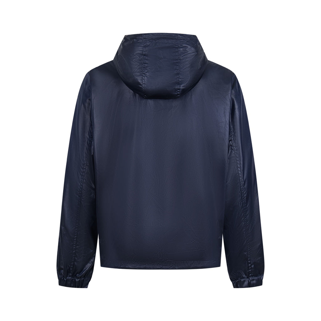 Navy hooded jacket back view with adjustable hood and ribbed cuffs