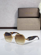 Brown and amber sunglasses with tortoise frames and gold-tone detailing