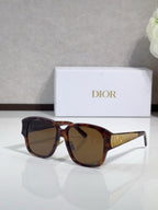 Dior sunglasses, brown tortoiseshell frame with dark lenses and gold bridge detail