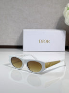 Dior sunglasses, white frames with gold logo temples and brown-tinted lenses