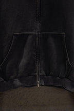 Balenciaga long zip-up hoodie hem area with center zipper and kangaroo pocket seam.