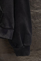Balenciaga long zip-up hoodie lower sleeve and cuff, dark fabric with seam detail.