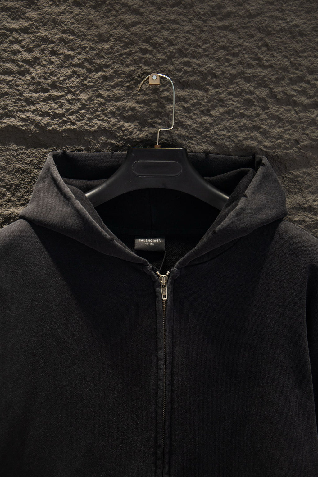 Balenciaga long zip-up hoodie hood with center front zipper; fabric texture detail.