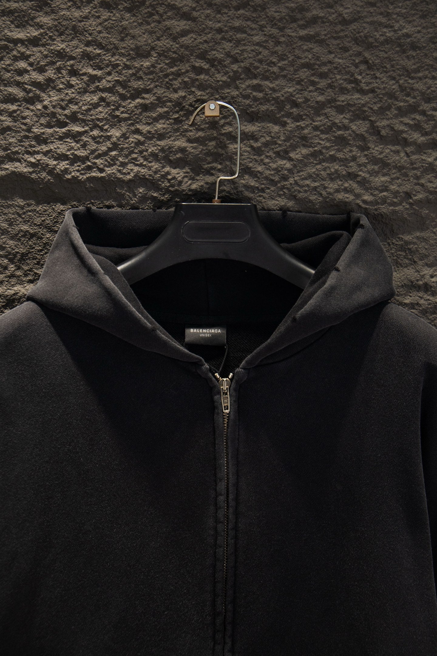 Balenciaga long zip-up hoodie hood with center front zipper; fabric texture detail.