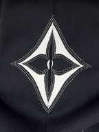 Black hoodie with large white diamond motif and central logo graphic