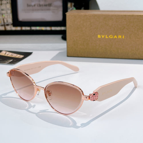 Rose gold round sunglasses with pink gradient lenses and thin metal bridge detail