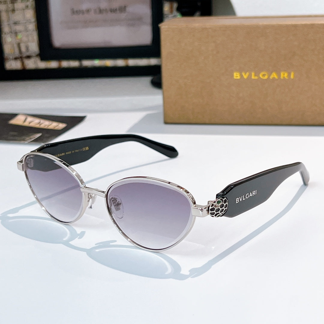 Silver round sunglasses with light lavender tinted lenses and black temple arms