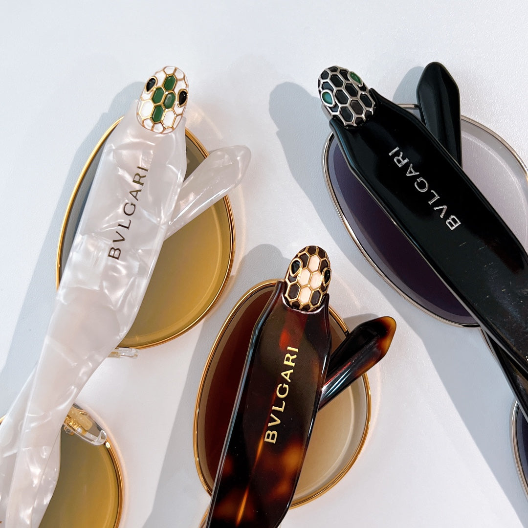 Assorted sunglasses: gold frame with amber lenses and black frame with dark lenses