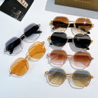 Assorted sunglasses with gold-tone frames and dark, amber, and brown lenses