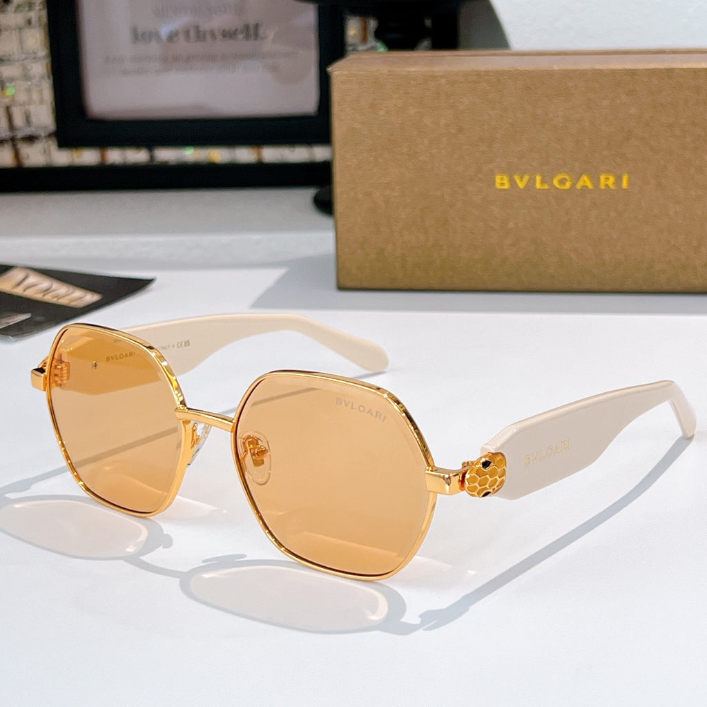 Gold-tone round sunglasses with amber lenses and white temple arms