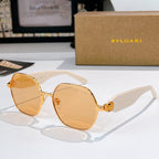Gold-tone round sunglasses with amber lenses and white temple arms