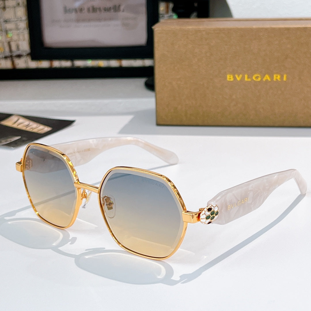 Gold-tone square sunglasses with blue-gray gradient lenses and clear white temple arms