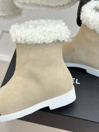 Chanel ladies beige suede ankle boot with white fuzzy cuff and white rubber sole
