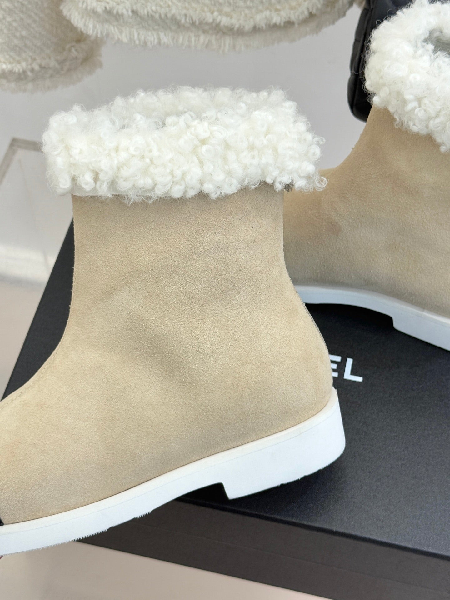 Chanel ladies beige suede ankle boot with white fuzzy cuff and white rubber sole