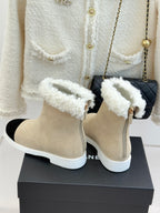 Chanel ladies beige suede ankle boots with white fuzzy cuff and black suede instep