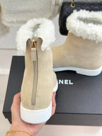 Chanel ladies beige suede ankle boot with side zipper, white fuzzy cuff, white sole