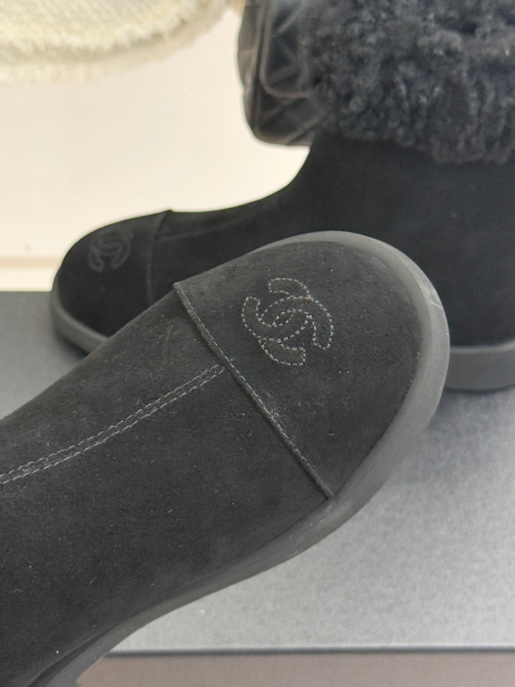 Black suede boot with faux-fur cuff and logo-stitched toe