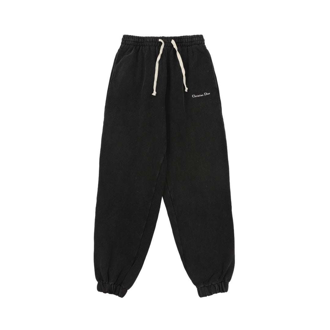 Black drawstring pants with elastic cuffs and Christian Dior logo