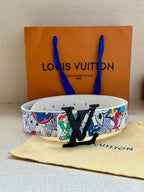 Louis Vuitton belt featuring white strap and multicolor graphic print with black LV buckle