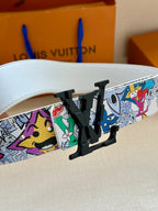 Louis Vuitton belt close-up: white strap with multicolor graphic print and black LV buckle
