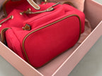 MiuMiu red mini bucket bag interior showing zip pocket and textured lining