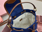 Miu Miu mini backpack with open top and beige fabric lining, brown drawcord straps