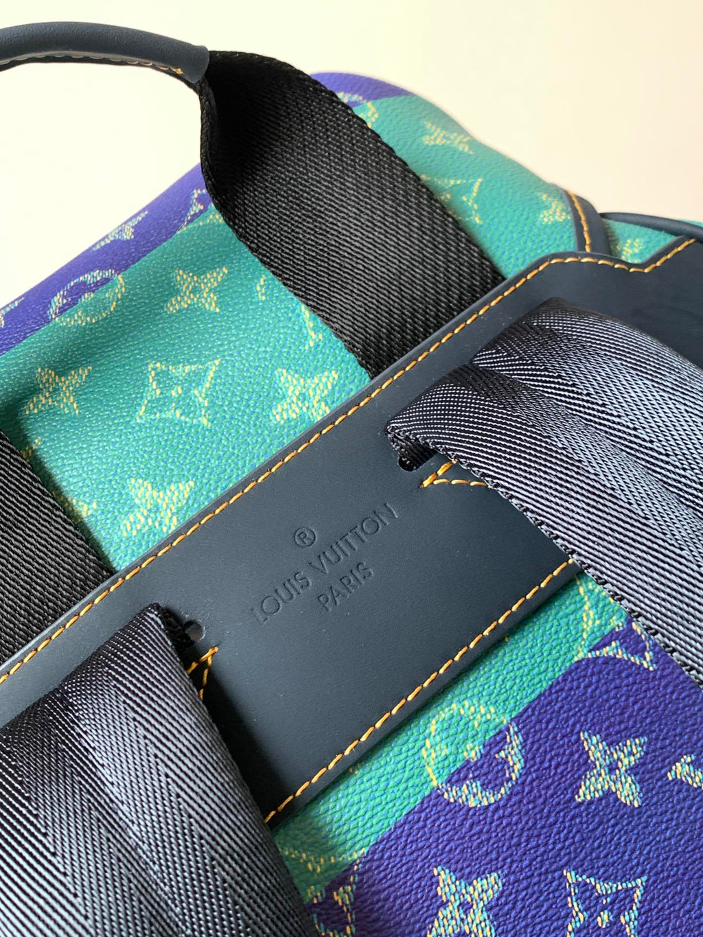 Louis Vuitton monogram backpack interior with leather trim and embossed logo panel