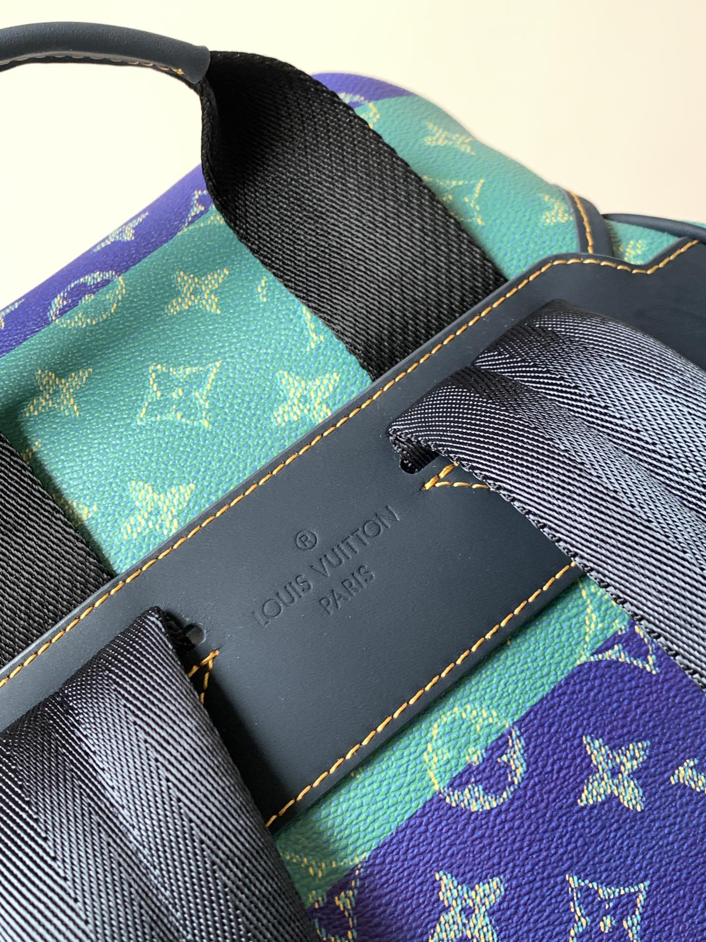 Louis Vuitton monogram backpack interior with leather trim and embossed logo panel