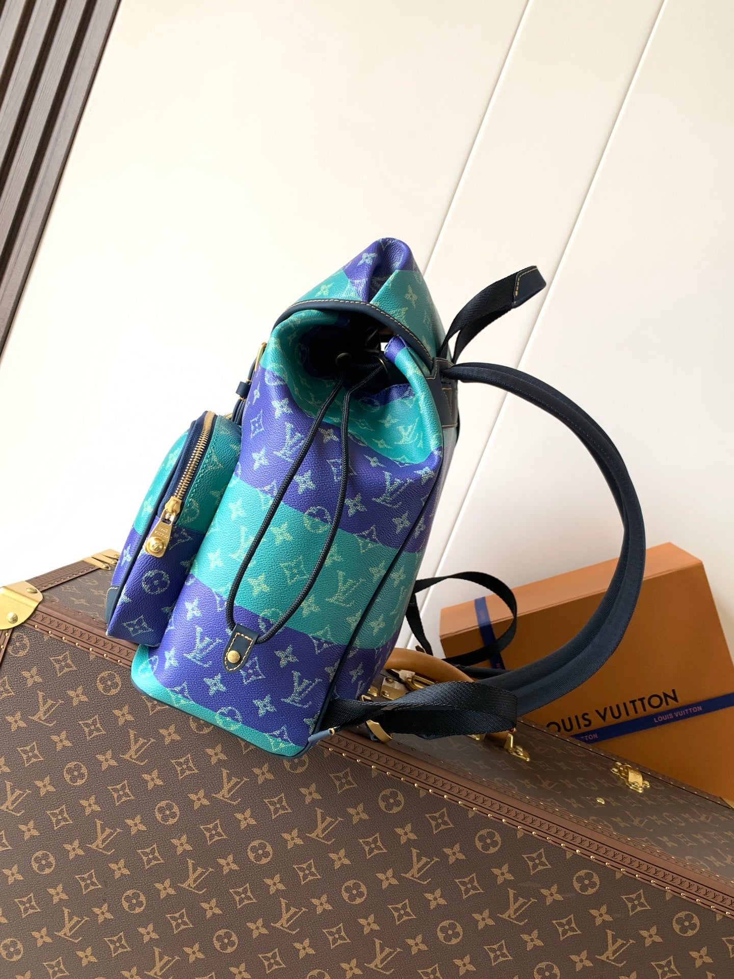 Louis Vuitton multicolor monogram backpack, side view with top handle and straps