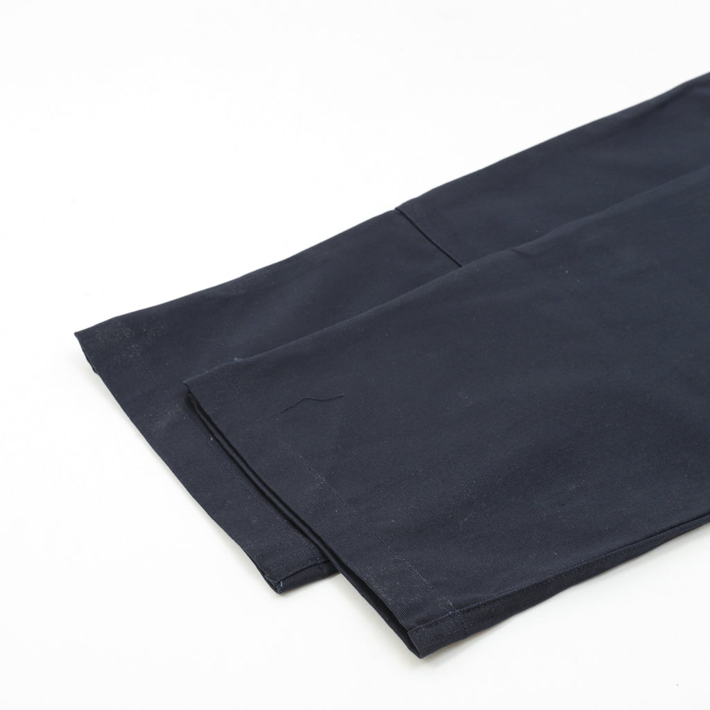 Dark navy pant leg with folded hem detail