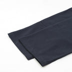 Dark navy pant leg with folded hem detail