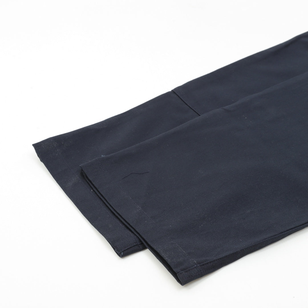 Dark navy pant leg with folded hem detail