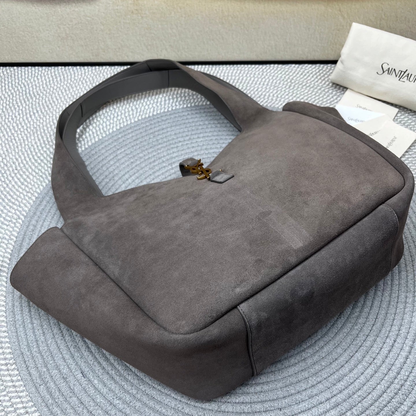 Gray suede shoulder tote bag with inner top opening and gold-toned hardware